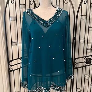 Sheer top with sequin accents